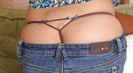 Stunning american brunette milf Eve Angel bares her ass in sexy jeans and plays with toy 