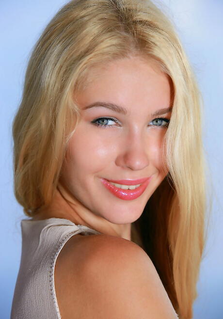 Very attractive blond youthful Genevieve Gandi in glasses exposes her ass and spreads her legs outdoor