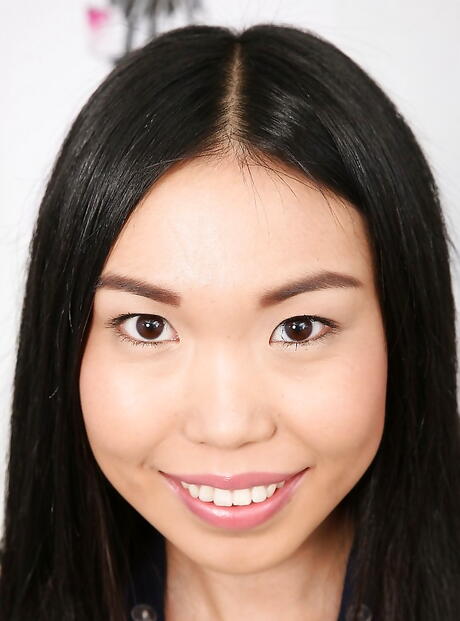 Shapely asian young Yiki in sexy skirt revealing tiny tits and pussy 