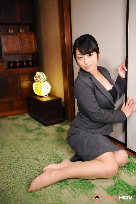Hot japanese brunette Kana Aizawa in sexy posing on camera in office