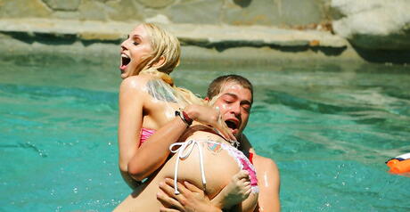 Sultry american blonde Christie Stevens exhibiting big tits and sexy ass at pool