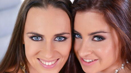 Sultry girls Lexie Candy and Mea Melone are playing with strap-on