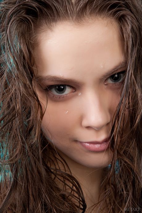 Desirable teen Kristel A removes her pigtails while getting naked in a bathtub