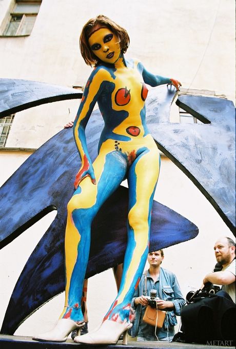 Redheaded teen Models No Name gets naked in a public place