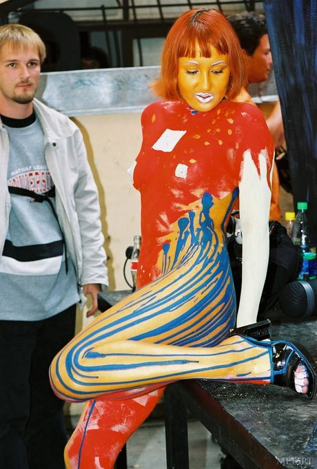 Redheaded teen Models No Name gets naked in a public place