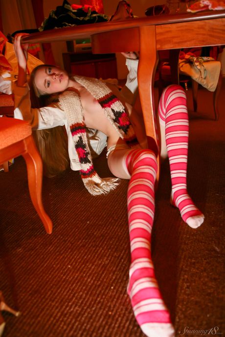 18-year-old blonde Avril A strikes great solo poses in black stockings