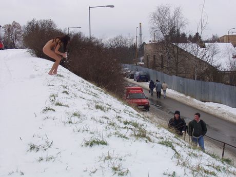 Adorable teen Darina A models totally naked on a rocky outcropping in public
