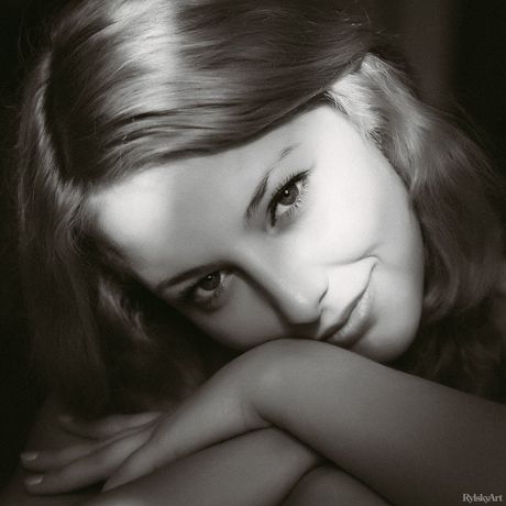 Nice teen Nikia bares her body on a blanket in a field of wildflowers