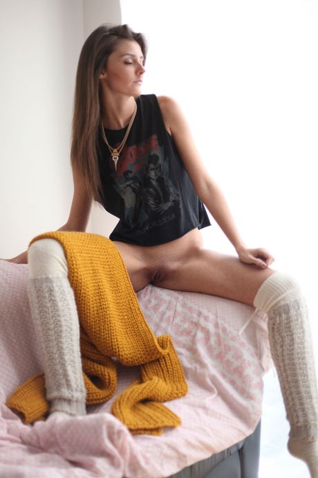 Cute teen Sunshine A spreading legs to show bald pussy close up on couch