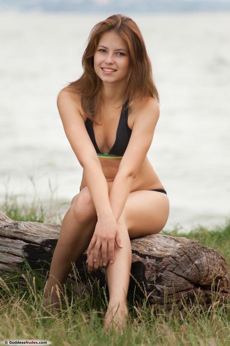 Svelte teen with tiny tits Hilary C poses nude in a solo