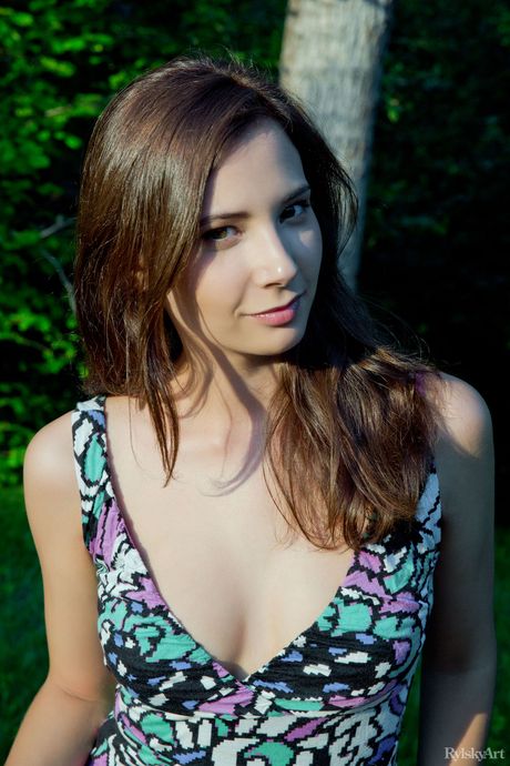 Delicate teen Oretha Mars gets naked on a patio in a pair of sandals