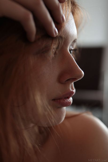 Skinny redheaded teen Riccarda shows her small tits and poses naked