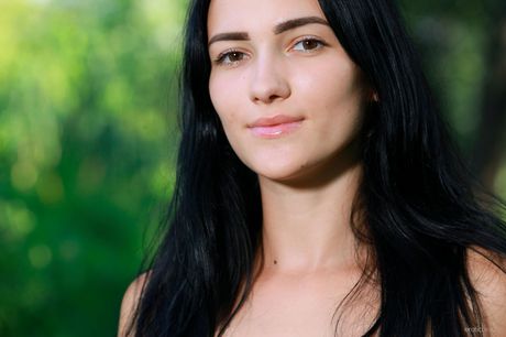 Angelic teen Indiana Blanc models totally naked in a field of tall grass