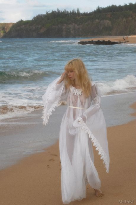 Blonde teen Jane A shows her small tits and poses naked on the beach