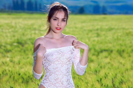 Gabriele strips off her white lace bodysuit and exposes her slender figure