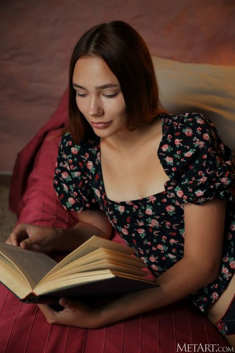 Tender teen Janey removes her underwear to get totally naked on a bed