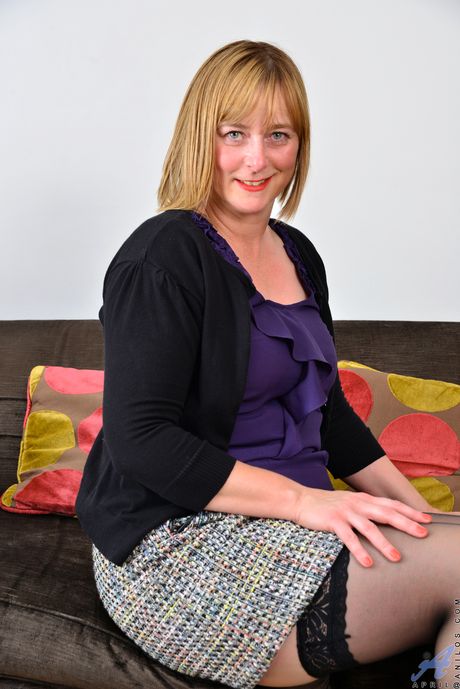 Blonde mature with big tits April shows her hairy pussy in stockings>