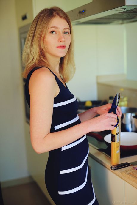 Sexy blonde teen Mila I gets naked in the kitchen before eating spaghetti