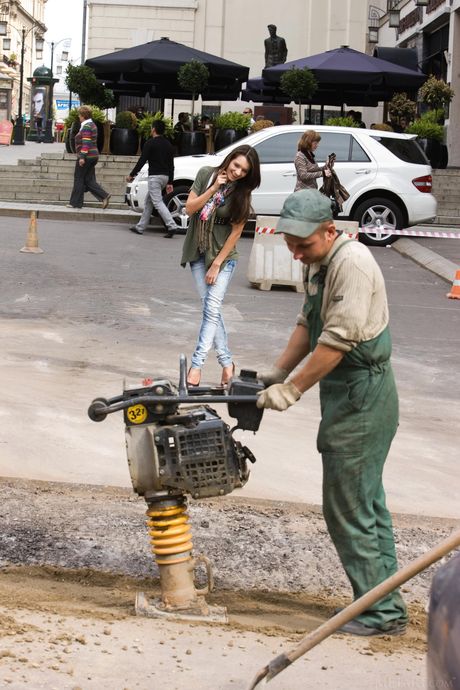 Barely legal girl Leila A goes naked on a patio in high heels