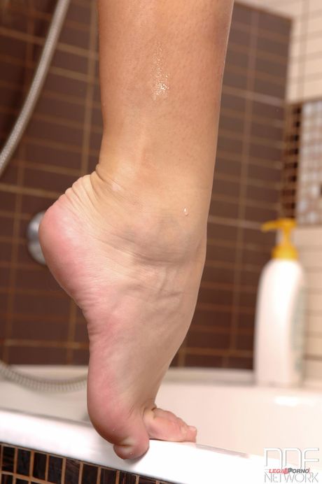 Ukrainian beauty Ivana Sugar toys her shaved pussy while posing naked