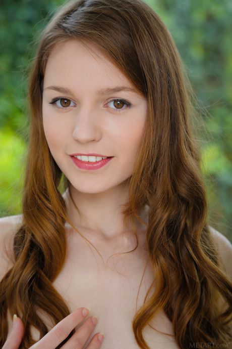 Cute teen Sofi Shane shows her big tits and shaved pussy in a solo