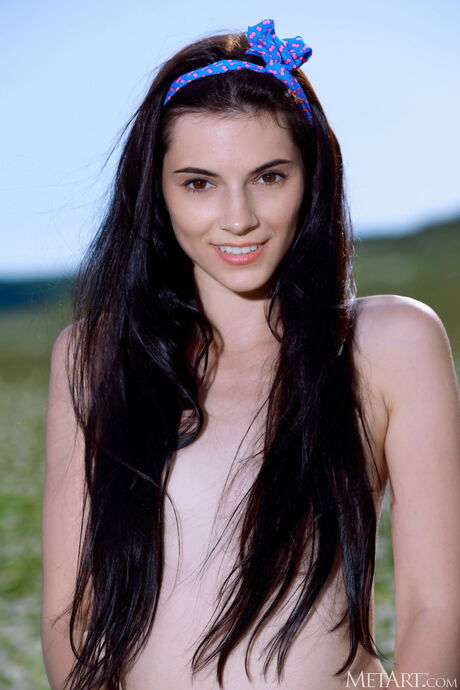 Adorable teen Aleksandrina strips off on a patch of grass