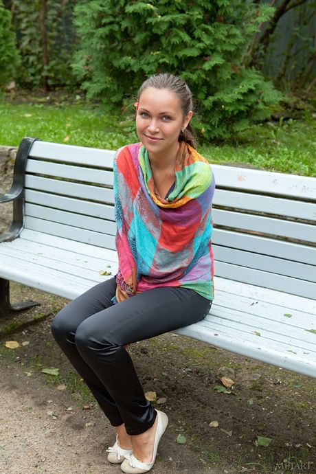 Alluring teen Sophia E uncovers her big tits and bald pussy