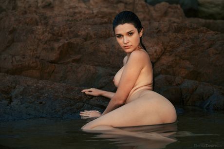 Brunette chick Serena Wood takes it all off in a bathtub