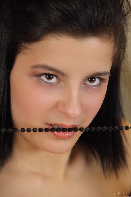 Lovely teen Michelle G removes her dress to model naked at a party