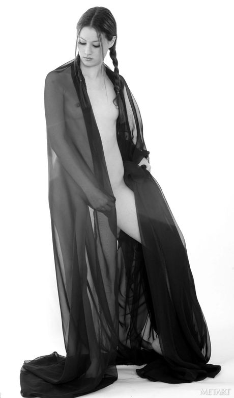 Lean teen Jassie A gets naked in pigtails and a tattoo on her arm