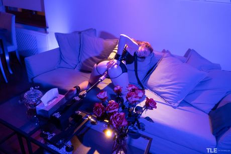 Kendra U is bound with leather cuffs and chains, and she is ready to play