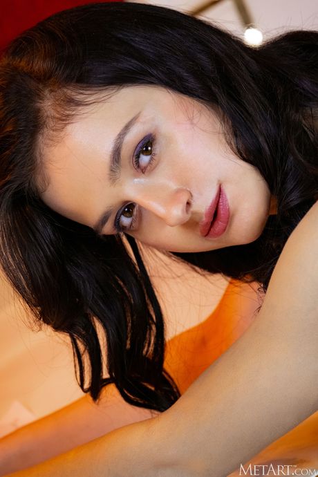 Alluring teen Anthea removes her lingerie and stockings to get bare naked