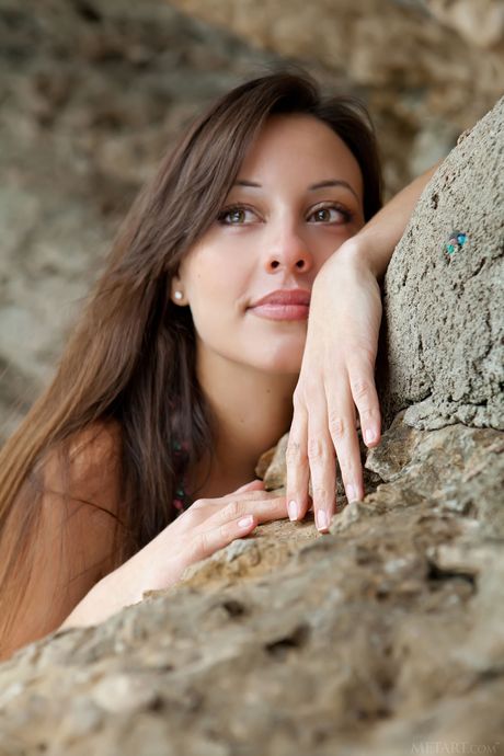 Delightful teen Lorena B models totally naked on a rocky outcropping by herself