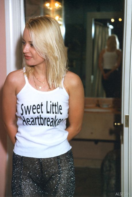 Blonde teen Jana Irrova shows her tiny tits and bald pussy in the bathroom