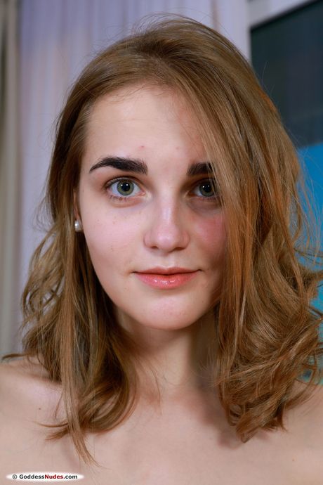 Naked teen Olga ZZ highlights her perfect ass while showing her pink pussy