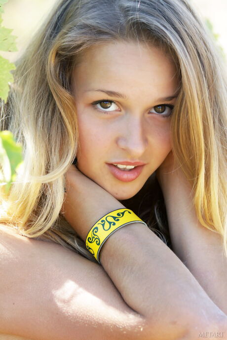 Svelte teen Toxic A strips her dress off and poses nude in the vineyard