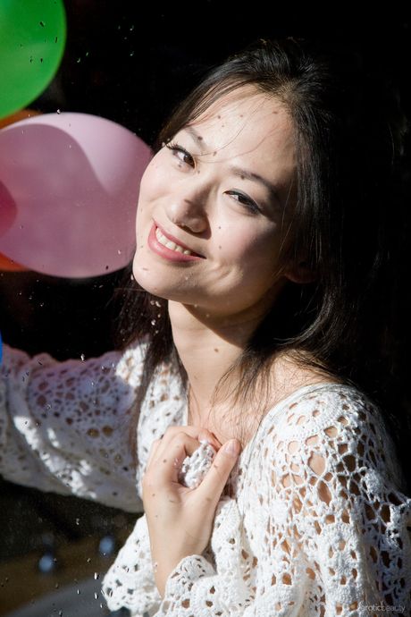 Charming Asian teen Willy exposes her hairy pussy and small tits in a solo