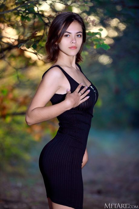 Thin teen Dzhili strips naked in the bush & shows her trimmed pussy