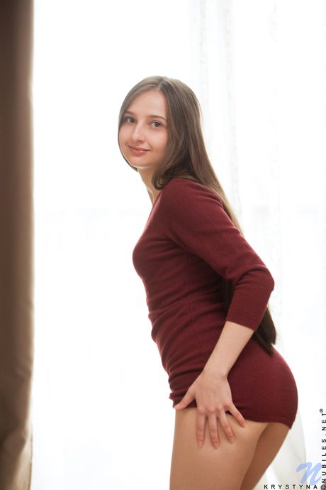 Krystyna slowly undresses and shows off her small boobs and her shaved pussy