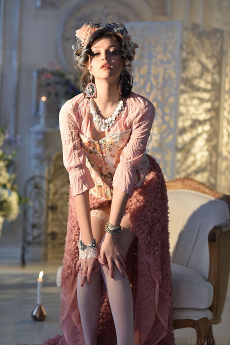 Engaging teen Lily Sands removes her lingerie and stockings to get naked