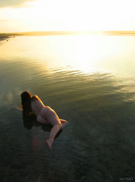 Sexy teen babes with small tits posing naked on the beach