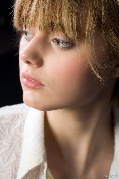 Desirable teen Amy A presents her big tits and trimmed pussy in the nude