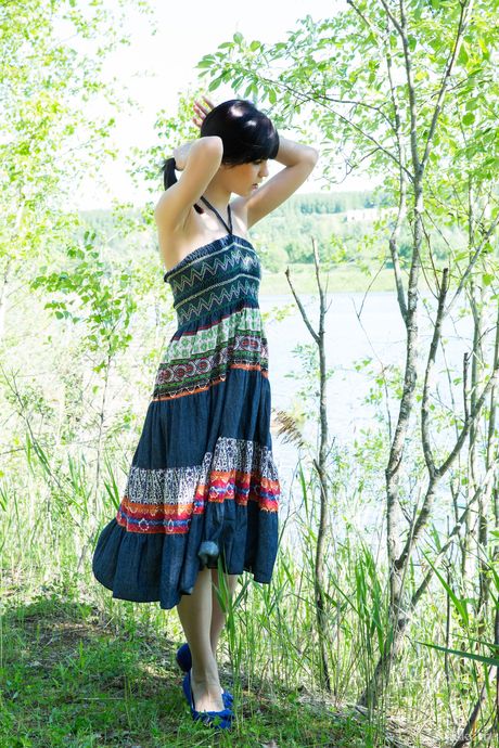 Slender teen Zelda strips naked and teases with her tiny tits and bald pussy