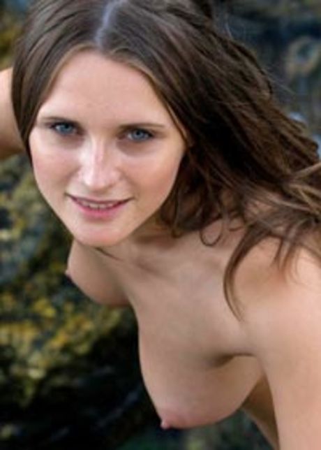 Thin teen Kaz poses naked on the beach and in the water by herself