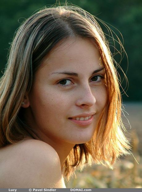 Svelte teen Lucy poses nude in the forest and shows her tiny tits and pussy