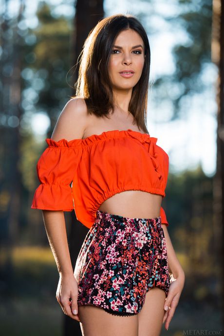 Stunning teen Zelda B strips down in the countryside and shows her big tits & bald pussy