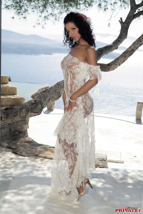 Brunette pornstar Angel Dark gets double fucked by two guys in the garden