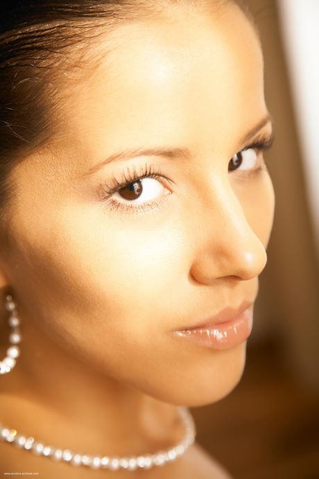 Brunette babe Angel Dark flaunting her big tits and bald pussy in a solo