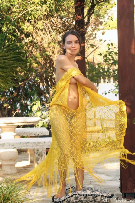 Danniela alluringly strips off her white dress and exposes her sexy body outside