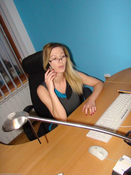 Blonde secretary Vanessa Y toys her pussy with a vibrator at the office